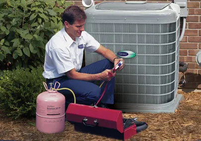 Technician from BellBrothersPlumbingHeatingandAir checking an air conditioning unit with tools and equipment in Brea.